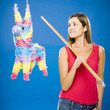 woman hitting a pinata