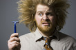 man with crazy hair holding a razor