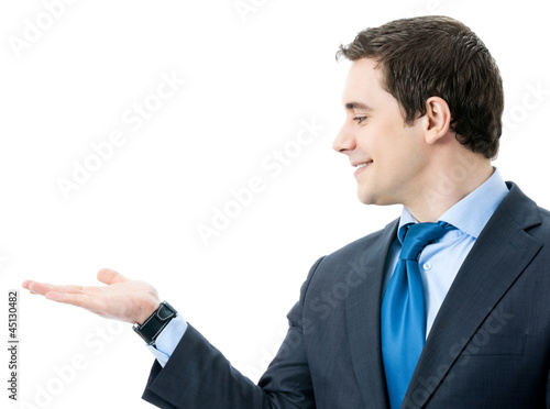 Photo: Business man showing, isolated Business man showing, isolated