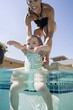 mother and child at a swimming pool