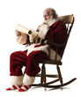 santa claus sitting in a rocking chair going over his list