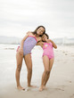 "USA, California, Los Angeles, Portrait of two girls (6-11) on beach"