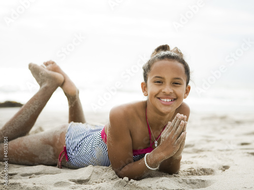 Photo: "USA, California, Los Angeles, Portrait of girl (10-11) on beach" "USA, California, Los Angeles, Portrait of girl (10-11) on beach"