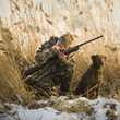 man and his dog duck hunting