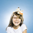 girl with birthday cake on her head