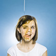 girl with honey pouring on her head