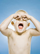 boy rubbing his eyes