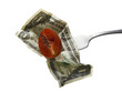 tomato and dollar on a fork