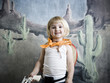 little girl dressing up as a cowgirl