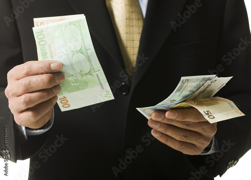 Photo: man counting money man counting money