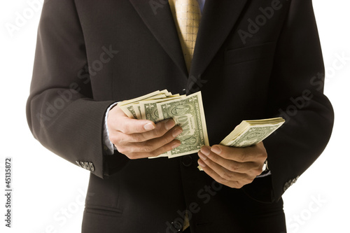 Photo: man counting money man counting money