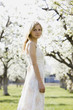 woman in a blossoming orchard