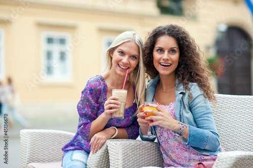 Photo: woman friends at cafe woman friends at cafe
