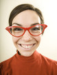 woman smiling wearing horn rimmed glasses