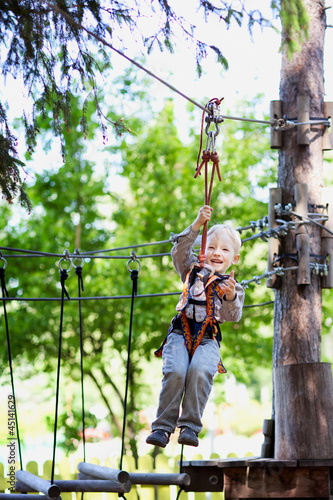 Photo: little boy ziplining little boy ziplining