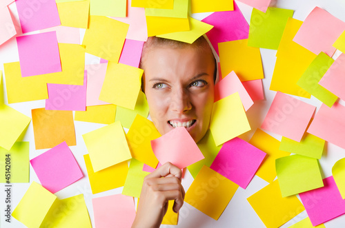 Photo: Woman with lots of reminder notes Woman with lots of reminder notes