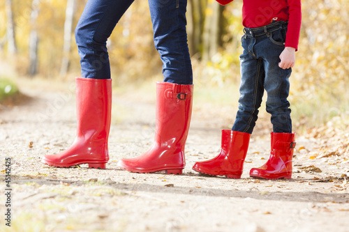Photo: detail of mother and daughter wearing rubber boots detail of mother and daughter wearing rubber boots