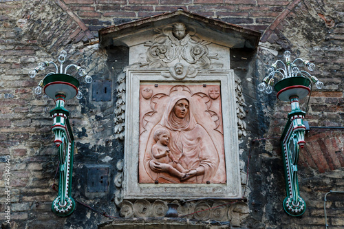 Photo: Madonna and the Child Relief in Siena, Tuscany, Italy Madonna and the Child Relief in Siena, Tuscany, Italy