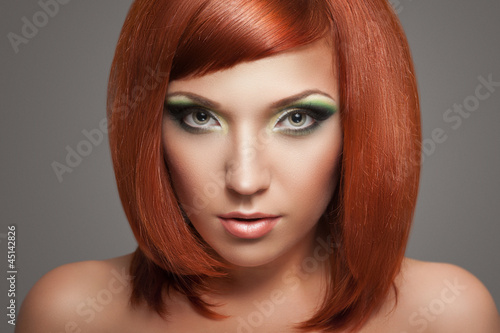 Photo: Beautiful Woman with Red Hair and bright makeup Beautiful Woman with Red Hair and bright makeup