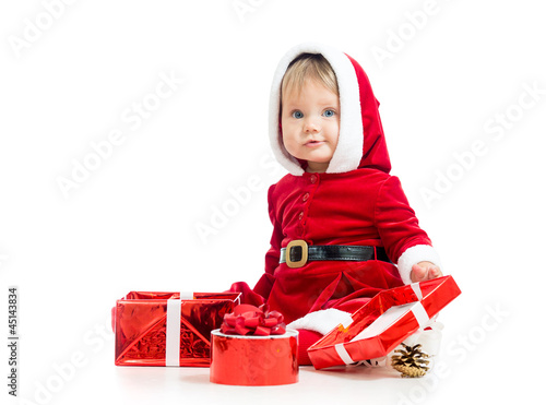Photo: Santa Claus baby girl with gift box isolated on white background Santa Claus baby girl with gift box isolated on white background