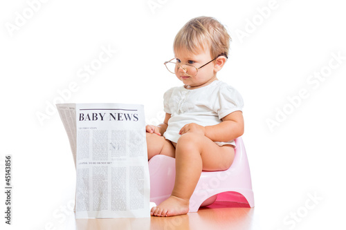 Photo: funny baby girl reading newspaper on chamberpot funny baby girl reading newspaper on chamberpot