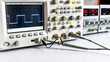 Electrical signals displayed on the screen of an oscilloscope