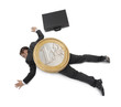 Foto: Joven ejecutivo aplastado por una moneda de euro. Joven ejecutivo aplastado por una moneda de euro.