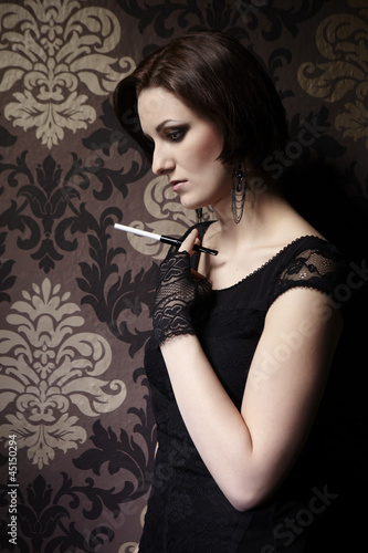 Photo: Nice lady model posing as a cigarette smoker Nice lady model posing as a cigarette smoker