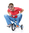 The curious man on a children's bicycle, on white background