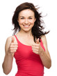 Woman is showing thumb up gesture