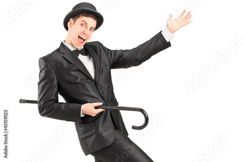 Photo: A performer dancing with a cane A performer dancing with a cane
