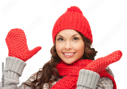 Photo: beautiful woman in hat, muffler and mittens beautiful woman in hat, muffler and mittens