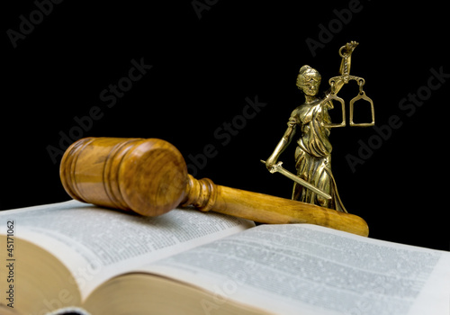 Photo: statue of justice on a black background statue of justice on a black background