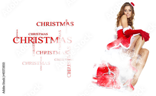 Photo: beautiful sexy girl wearing santa claus clothes in snow beautiful sexy girl wearing santa claus clothes in snow