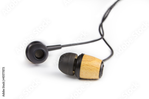 Photo: Earphones isolated on white Earphones isolated on white