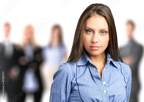 Photo: Confident businesswoman with her team Confident businesswoman with her team