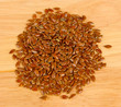 flax seeds on wooden background close-up