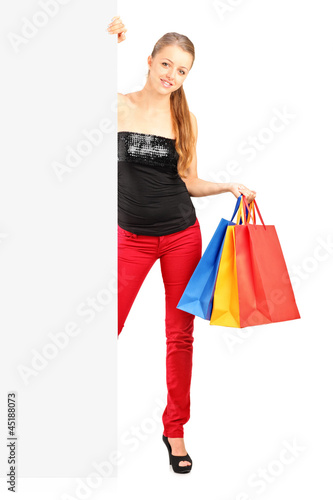 Photo: Smiling woman holding a shopping bags Smiling woman holding a shopping bags