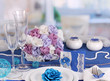 Serving fabulous wedding table in purple and blue color of the