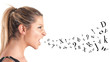 Photo: Woman profile shouting on white background with with letters. Woman profile shouting on white background with with letters.