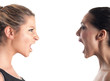 Photo: Women shouting each other against white background. Women shouting each other against white background.