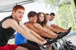 Photo: Group of People Cycling at Gym Group of People Cycling at Gym