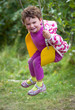 Foto: Girl laughing on swing Girl laughing on swing