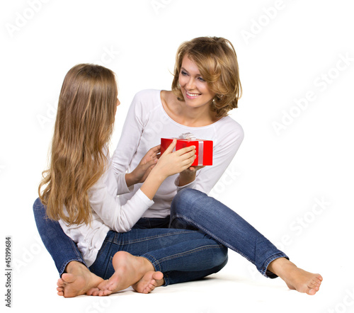Photo: daughter gives gift to mother daughter gives gift to mother