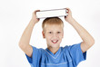 The boy with the book on the head