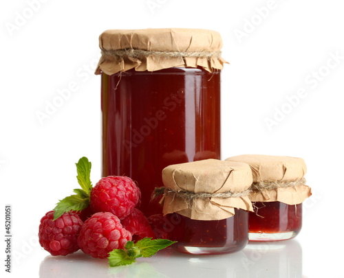 Photo: jars with jam and ripe raspberries with mint isolated on white jars with jam and ripe raspberries with mint isolated on white