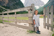 Portrait of four year old boy outdoors in the mountains. 