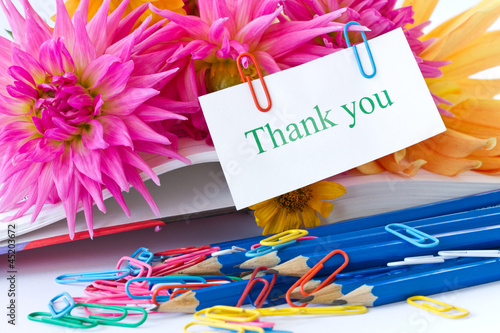 Photo: Autumn flowers with book and pencils Autumn flowers with book and pencils