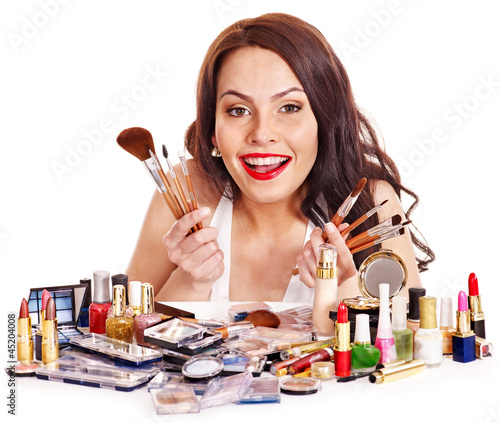 Photo: Girl holding makeup brush. Girl holding makeup brush.