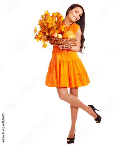 Photo: Woman holding orange leaves. Woman holding orange leaves.